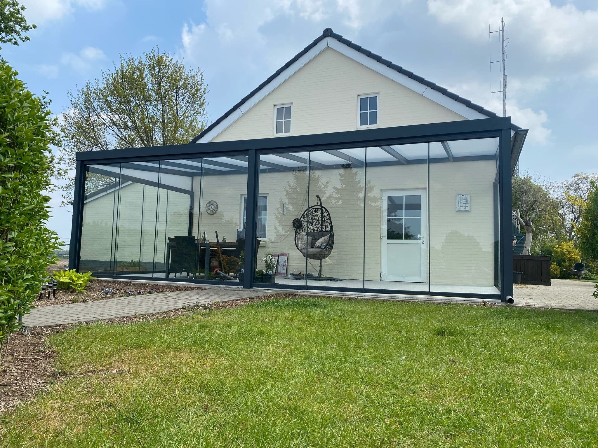 A glass roof that invites natural light and creates a bright, cozy atmosphere all year round.